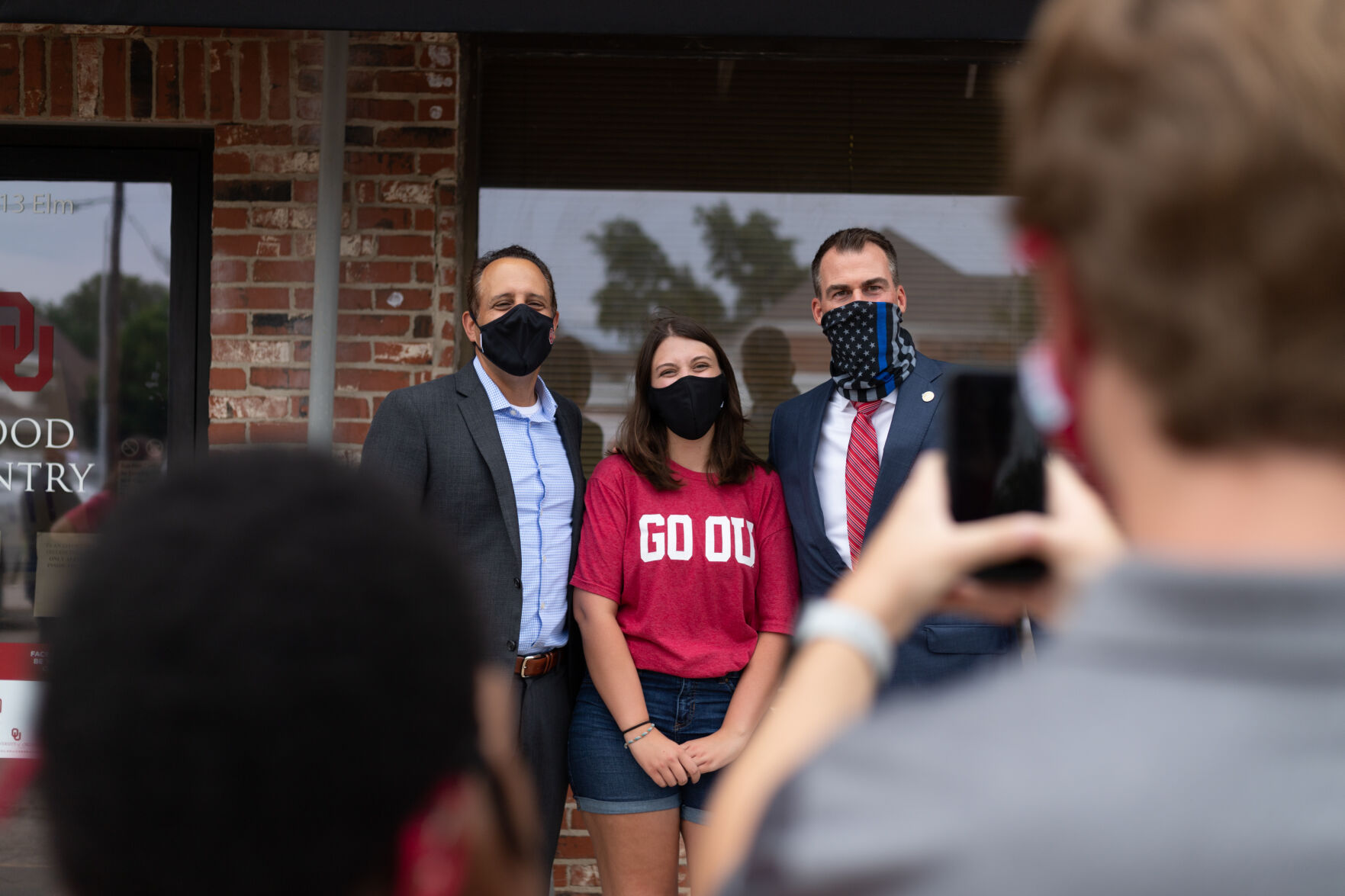 Posing with OU President Joseph Harroz and Oklahoma Governor Kevin Stitt
